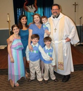 Fr. Scott & Lizz Looker with their children, Easter of 2015.
